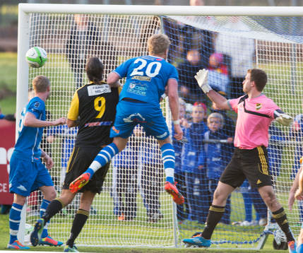  Osbys Oscar Hall nickar in 1-0 i matchen i division 3 mellan IFK Osby och IFK Hässleholm i Osby 15 maj  2014.