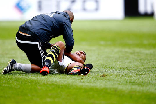 s Nabil Bahoui har ont under fotbollsmatchen i Allsvenskan mellan AIK och Kalmar den 12 juli 2014 i Stockholm. 