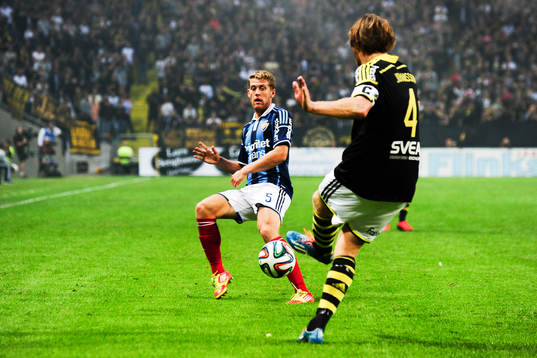 s Nils-Eric Johansson och Djurgårdens Stefan Karlsson under fotbollsmatchen i Allsvenskan mellan AIK och Djurgården den 13 augusti 2014 i Stockholm. 