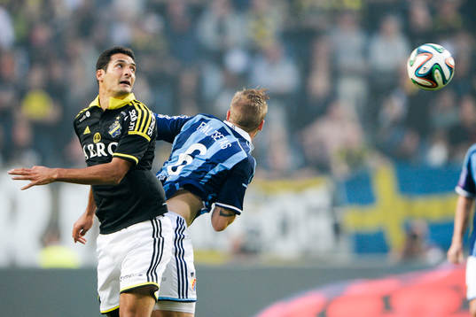 s Celso Borges och Djurgårdens Aleksander Faltsetas under fotbollsmatchen i Allsvenskan mellan AIK och Djurgården den 13 augusti 2014 i Stockholm. 