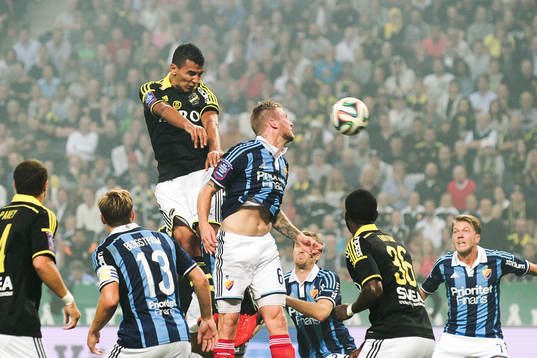 s Nabil Bahoui och Djurgårdens Aleksander Faltsetas under fotbollsmatchen i Allsvenskan mellan AIK och Djurgården den 13 augusti 2014 i Stockholm. 