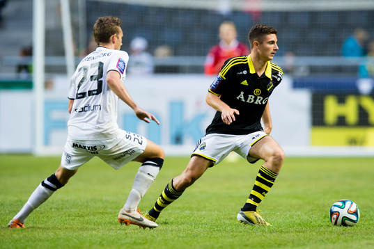 s Marko Nikolic och Häckens Simon Sandberg under fotbollsmatchen i Allsvenskan mellan AIK och BK Häcken den 24 Augusti 2014 i Stockholm. 