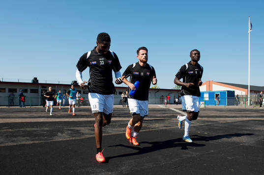 FC Rosengårds Dennis Anwi, Ylli Shabani och Emmanuel Okine jobbar in före fotbollsmatchen  i Division 2 östra Götaland mellan FC Rosengård och Höllviken den 6 september 2014 i Malmö.