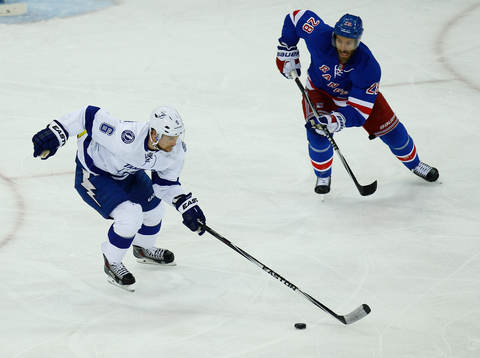 Tampa Bay Lightning Anton Stralman (L) skates away from New