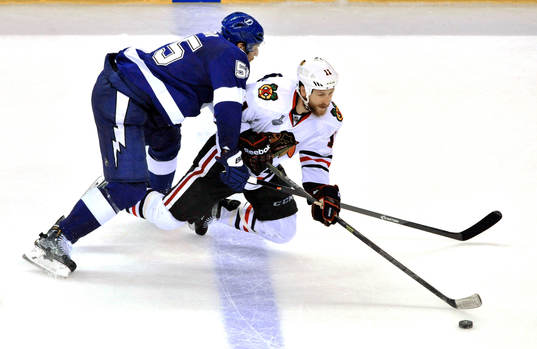 Tampa Bay's Braydon Coburn, left, pressures Chicago's