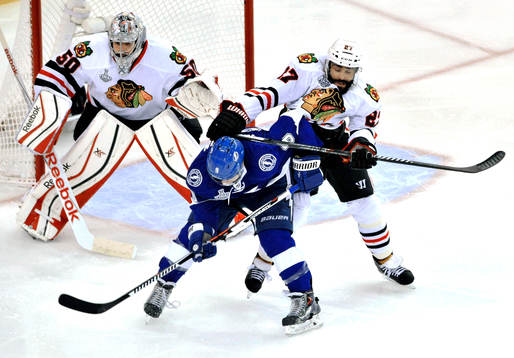 Chicago goalie Corey Crawford (50) and Johnny Oduya (27)