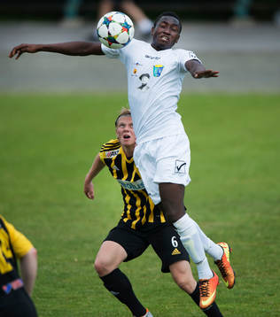 IFK Hässleholms Philip Bengtsson kollar in en motståndare som tar ner bollen i matchen i division 2 mellan IFK Hässleholm och BW90 i Hässleholm 13 juni 2015.