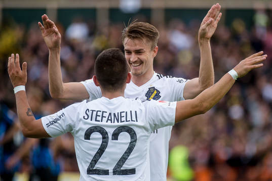s Nicolas Marcelo Stefanelli och Rasmus Lindkvist jublar efter 0-2 under fotbollsmatchen i Allsvenskan mellan Sirius och AIK den 6 augusti 2017 i Uppsala.