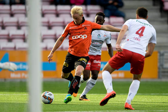 Geir André Herren of Åsane and Razak Nuhu and Mislav Leko of Fredrikstad during the OBOS-ligaen match between Fredrikstad and Åsane on September 3, 2017 in Fredrikstad.
