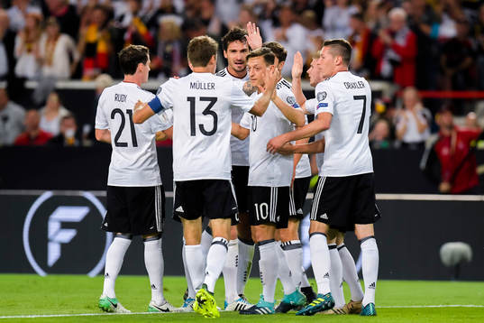 Mesut Özil of Germany celebrates with teammates after scoring the 1-0 goal