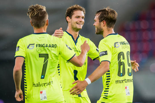 Ole Jørgen Halvorsen, Joackim Jørgensen, Patrick Mortensen of Sarpsborg celebrates after teammate Krepin Diatta (not pictured) has scored 1-0