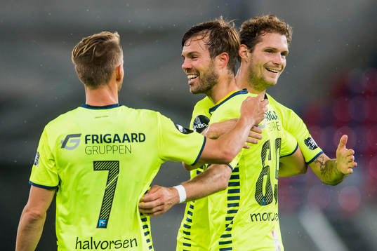 Ole Jørgen Halvorsen, Patrick Mortensen and Joackim Jørgensen of Sarpsborg celebrates after teammate Krepin Diatta (not pictured) has scored 1-0