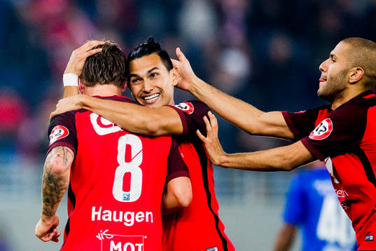 Fredrik Haugen of Brann celebrates with his teammates after scoring 1-1