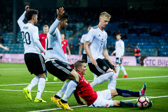 Thilo Kehrer and Benjamin Henrichs of Germany, Martin Ødegaard of Norway and Timo Baumgartl of Germany