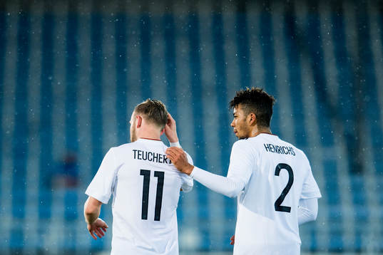 Cedric Teuchert of Germany celebrates with Benjamin Henrichs after scoring 0-1