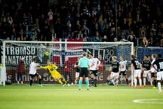 Eirik Ulland Andersen of Strømsgodset (not pictured) scores 1-0 behind goalkeeper Sondre Rossbach of Odd