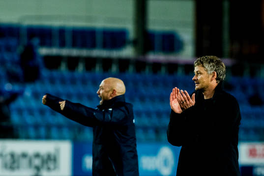 Mark Dempsey, head coach of Molde, and Ole Gunnar Solskjær, manager of Molde, celebrate after the Eliteserien match between Molde and Brann on October 15, 2017 in Molde. 
