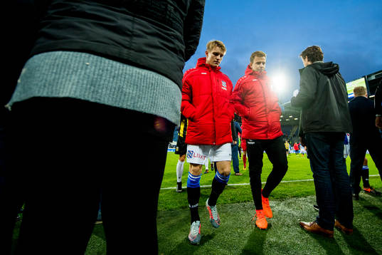 Martin Ødegaard and Nicolai Næss of Heerenveen walk off the pitch