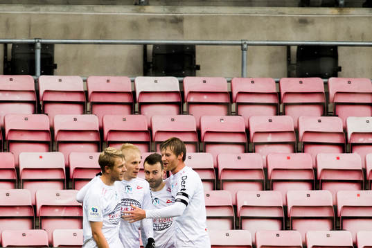 Joona Veteli of Fredrikstad celebrates with his teammates after 3-0