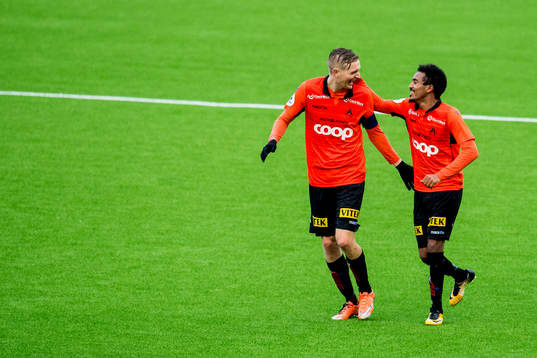 Senai Hagos of Åsane celebrates with team-mate Erik Huseklepp after scoring 2-1
