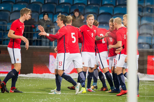 Martin Ødegaard of Norway celebrates with his teammates after scoring 1- 0