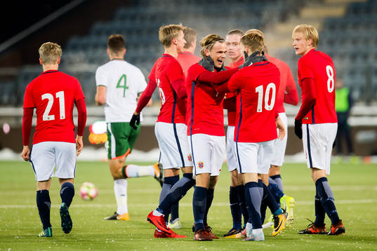 Iver Fossum of Norway celebrates with his teammates after scoring 2-1