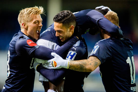 Tokmac Nguen of Strømsgodset celebrates with teammates Eirik Ulland Andersen, Bassel Jradi and Marcus Pedersen after scoring 2-2