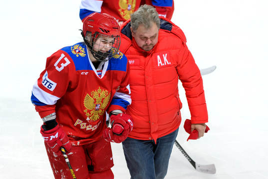 Nina Pirogova of OAR (Russia) gets help to leave the ice