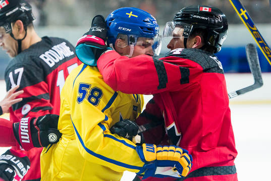 Anton Lander of Sweden and Chay Genoway of Canada fight