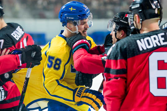 Anton Lander of Sweden and Chay Genoway of Canada fight