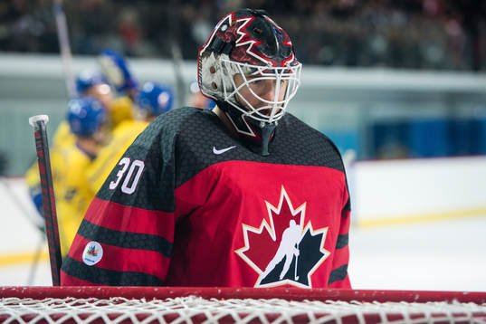 Goaltender Ben Scrivens of Canada looks dejected