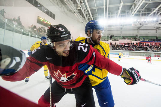 Maxim Lapierre of Canada and Mikael Wikstrand of Sweden