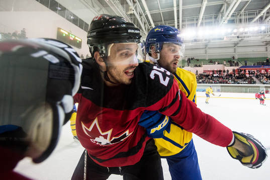 Maxim Lapierre of Canada and Mikael Wikstrand of Sweden