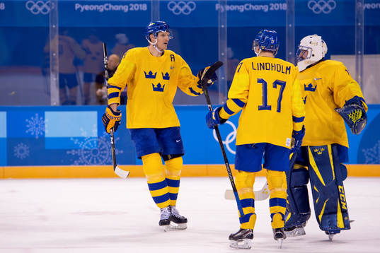 Staffan Kronwall, Pär Lindholm of Sweden and Goaltender