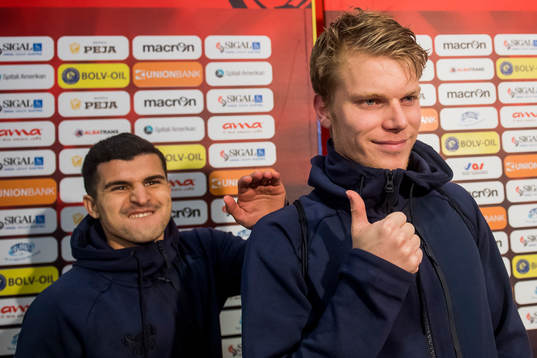 Tarik Elyounoussi and Sigurd Rosted of Norway celebrate in