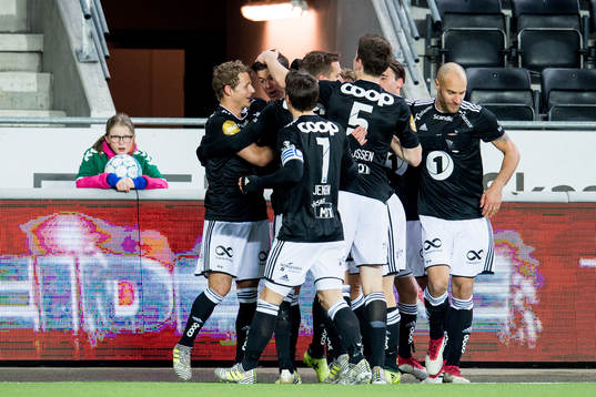 Pål André Helland of Rosenborg celebrates with teammates after scoring 0-1