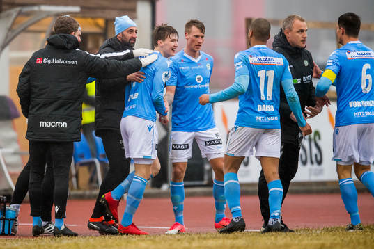Axel Kryger of Sandnes Ulf celebrates with Bojan Zajic, assistant coach of Sandnes Ulf, and Bengt Sæternes, head coach of Sandnes Ulf, after scoring 1-3