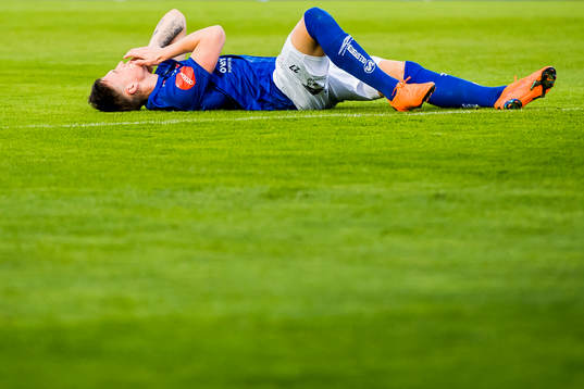 Andreas Helmersen of Ranheim lies down with an injury