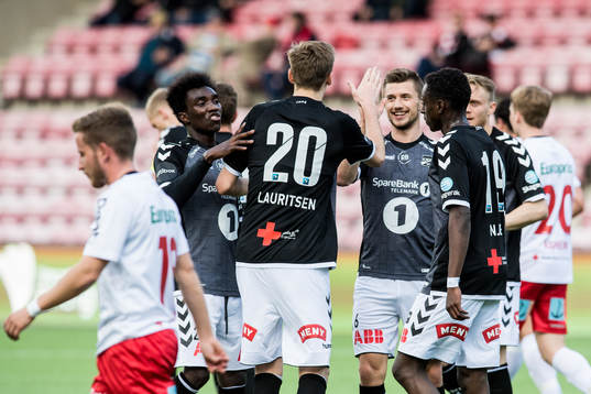 Tobias Lauritsen of Odd celebrates with teammates after scoring 2-0