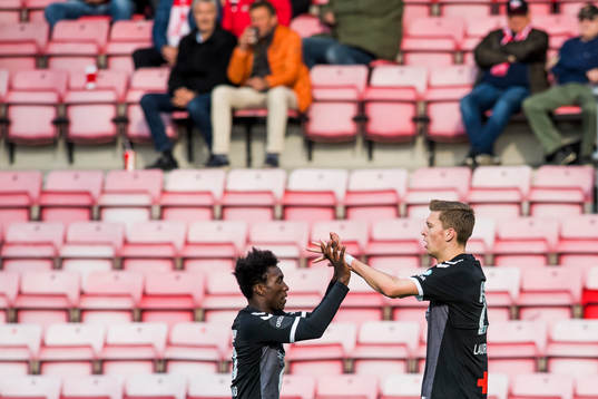 Tobias Lauritsen of Odd celebrates with John Shuguto Kitolano after scoring 0-1