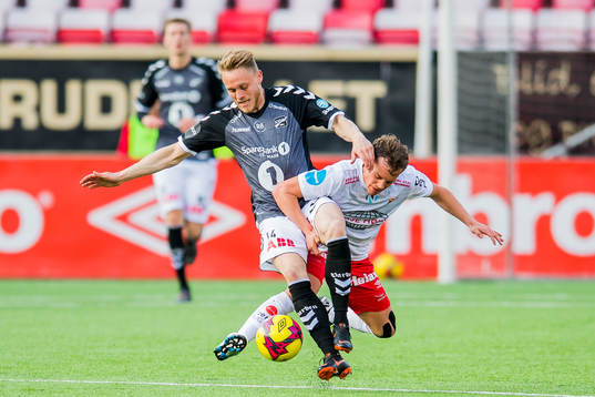 Fredrik Nordkvelle of Odd and Rino Falk Larsen of Fredrikstad