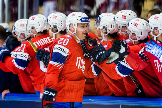 Anders Bastiansen of Norway celebrates with teammates
