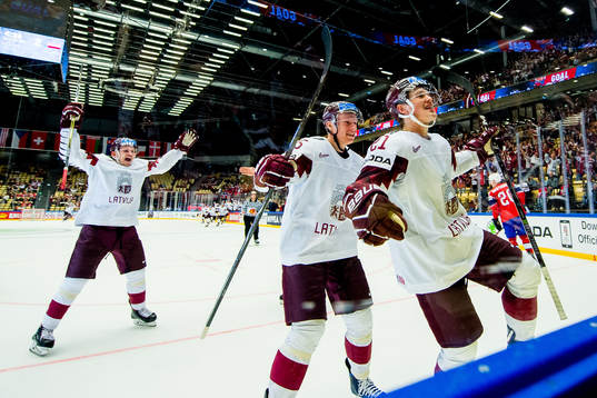 Rudolfs Balcers of Latvia celebrates with teammates