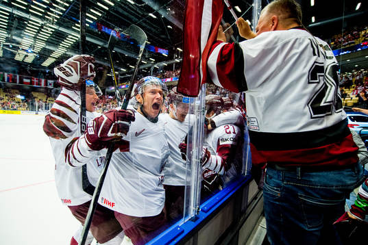 Rudolfs Balcers of Latvia celebrates with Andris Dzerins,