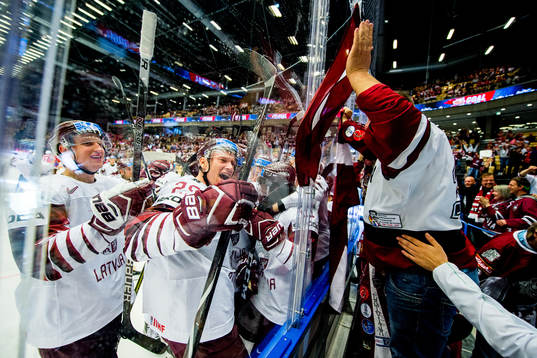 Rudolfs Balcers of Latvia celebrates with Andris Dzerins,