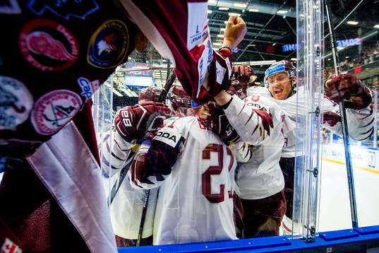 Rudolfs Balcers of Latvia celebrates with Andris Dzerins,