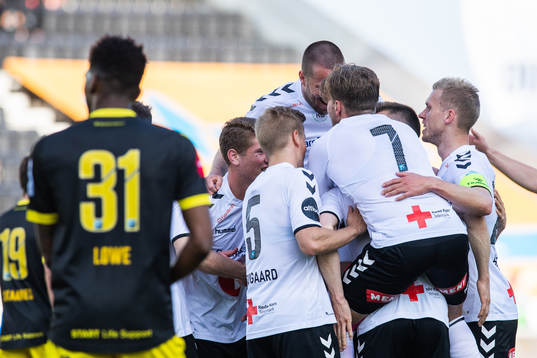 Fredrik Nordkvelle of Odd celebrate with team mates after he scored 1-0