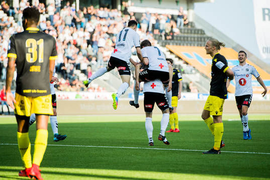 Fredrik Nordkvelle of Odd celebrates with his teammates after scoring 1-0