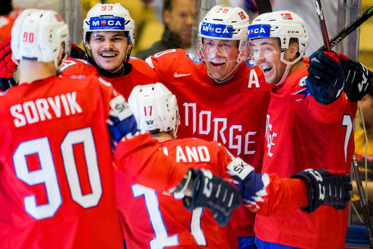 Anders Bastiansen of Norway celebrates with teammates