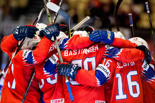 Anders Bastiansen of Norway celebrates with teammates